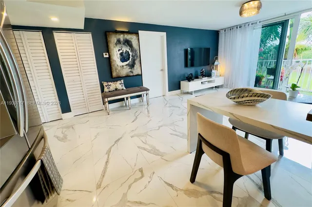 a view of a dining room with furniture and window