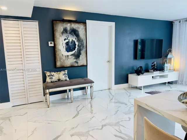 a bedroom with a bed and a table in it