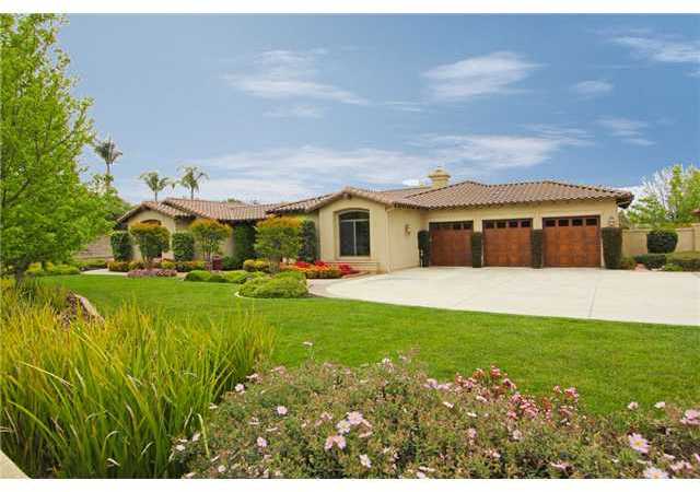 Lush landscaping surround this meticulously maintained property.