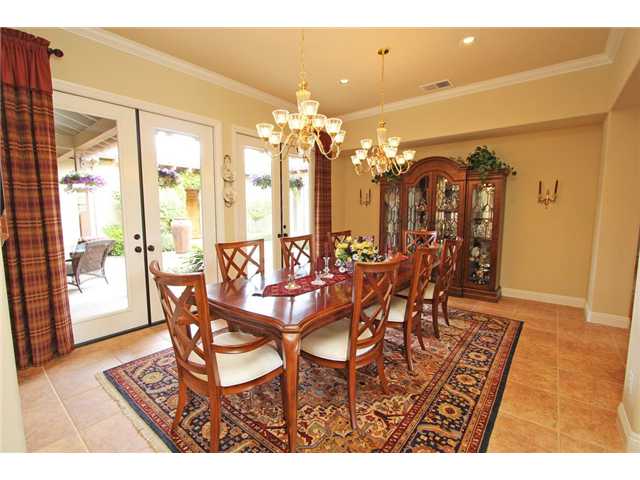 4010 Limber Pine Road Fallbrook, CA 92028 - Photo 13 of 24 Large dining room with french doors leading to private courtyard.