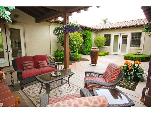 Multiple french doors open onto private courtyard - perfect for a quiet moment.