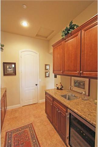 4010 Limber Pine Road Fallbrook, CA 92028 - Photo 10 of 24 Butler's pantry boasts extra storage with leaded glass cabinet doors, wine cooler and sink.