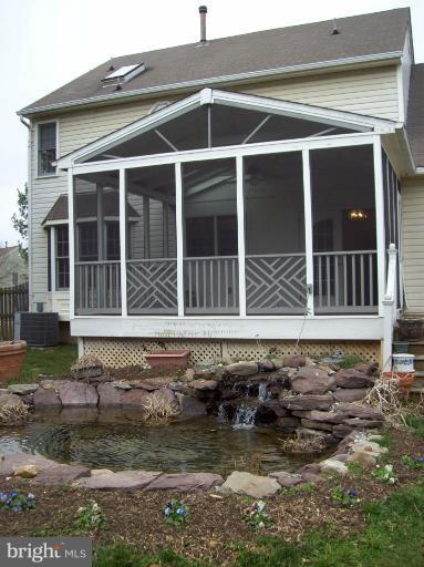 14120 Eternity Road Germantown, MD 20874 - Photo 21 of 29 Screened porch and pond