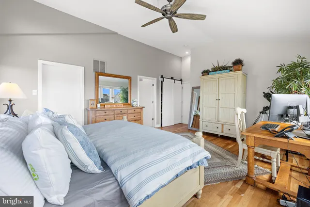 a bedroom with a bed and a table in it