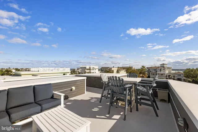 a view of dinning table and chairs in the terrace