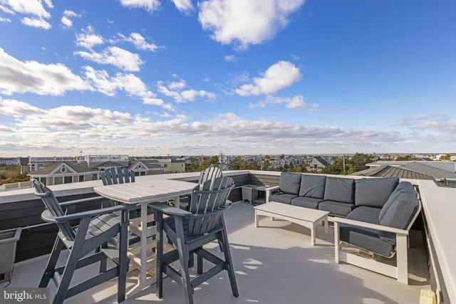 a view of a terrace with furniture and a table