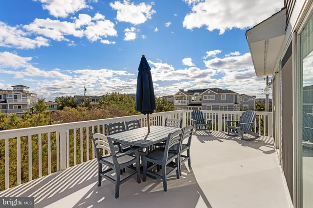 a view of a balcony with furniture