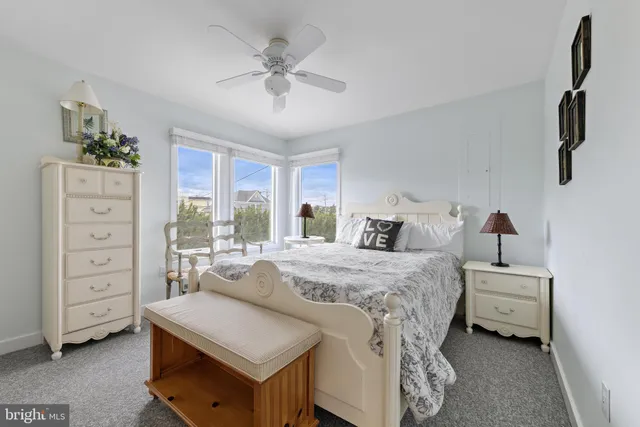 a bed room with a bed and a window