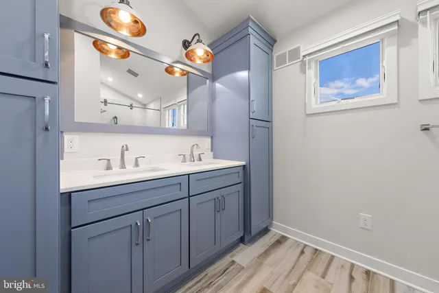 a bathroom with a sink and a mirror