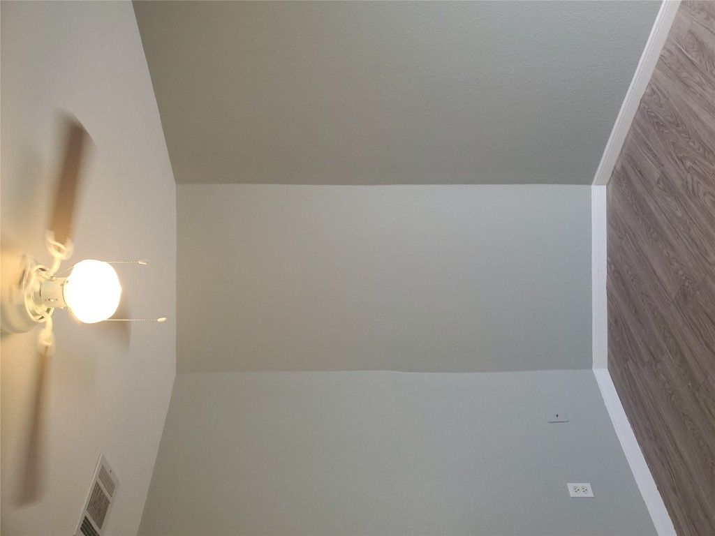 2221 Creekside Lane, Unit B Georgetown, TX 78626 - Photo 16 of 33 Empty room with wood finished floors and a ceiling fan