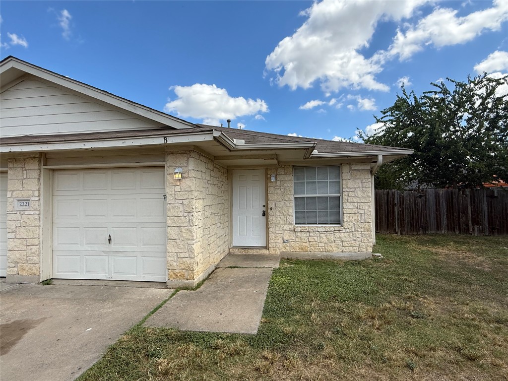 2221 Creekside Lane, Unit B Georgetown, TX 78626 - Photo 2 of 33 View of front of house featuring stone siding and roof with shingles