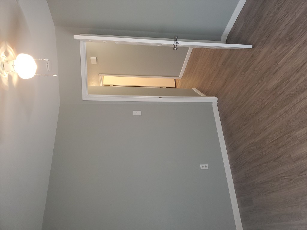 2221 Creekside Lane, Unit B Georgetown, TX 78626 - Photo 21 of 33 Empty room with baseboards and dark wood finished floors