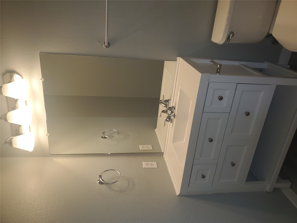 2221 Creekside Lane, Unit B Georgetown, TX 78626 - Photo 23 of 33 Bathroom with a textured wall and vanity