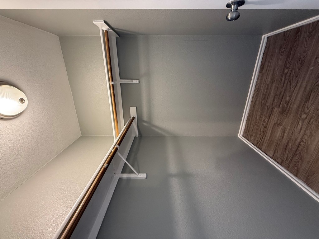 2221 Creekside Lane, Unit B Georgetown, TX 78626 - Photo 33 of 33 Walk in closet with dark wood-style flooring