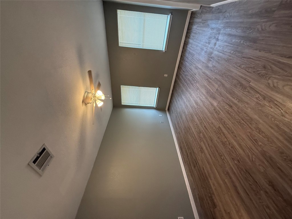 2221 Creekside Lane, Unit B Georgetown, TX 78626 - Photo 8 of 33 Unfurnished room featuring dark wood finished floors and a ceiling fan