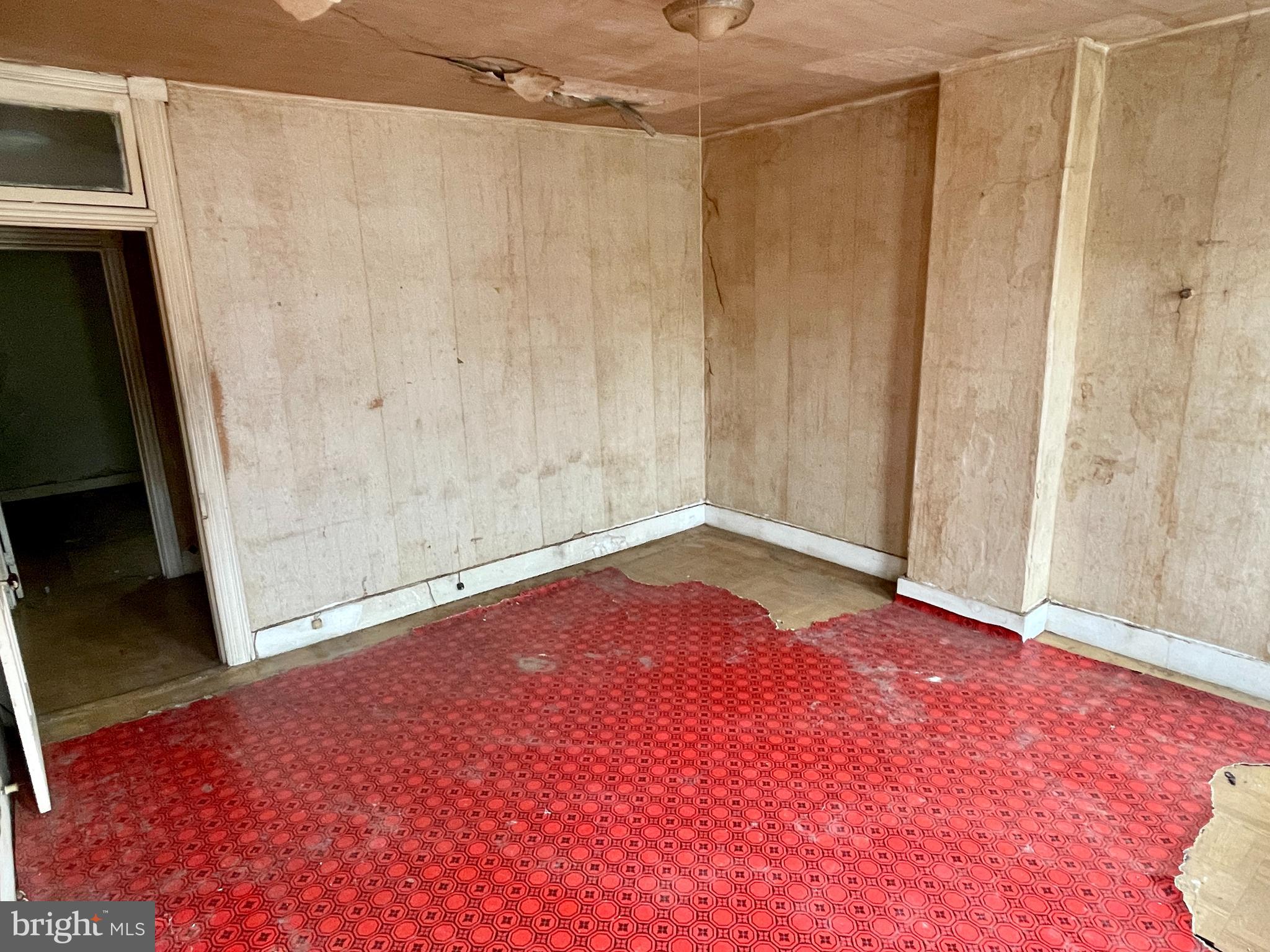 1626 North Wolfe Street Baltimore, MD 21213 - Photo 11 of 20 a view of a room with an empty room and wooden floor