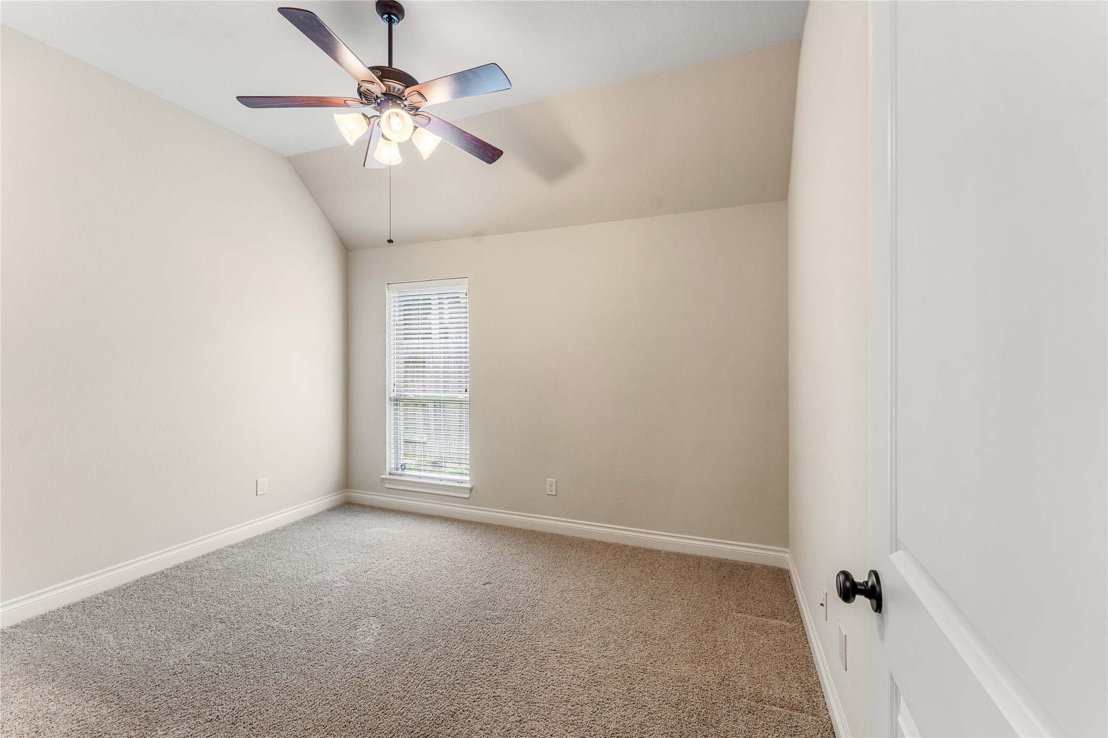 2938 Bobby Jones Road Katy, TX 77494 - Photo 18 of 28 an empty room with a chandelier fan and windows
