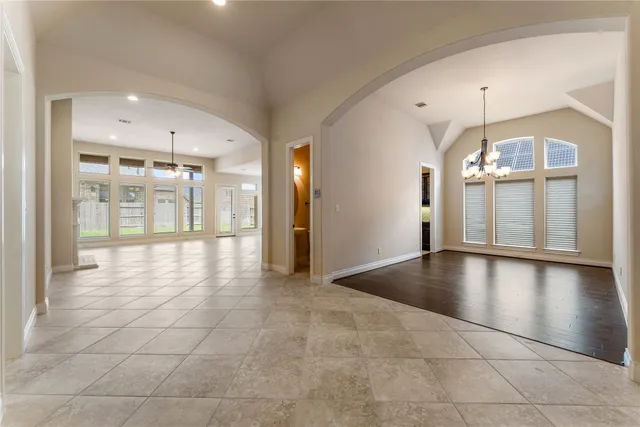 a view of an entryway with a chandelier