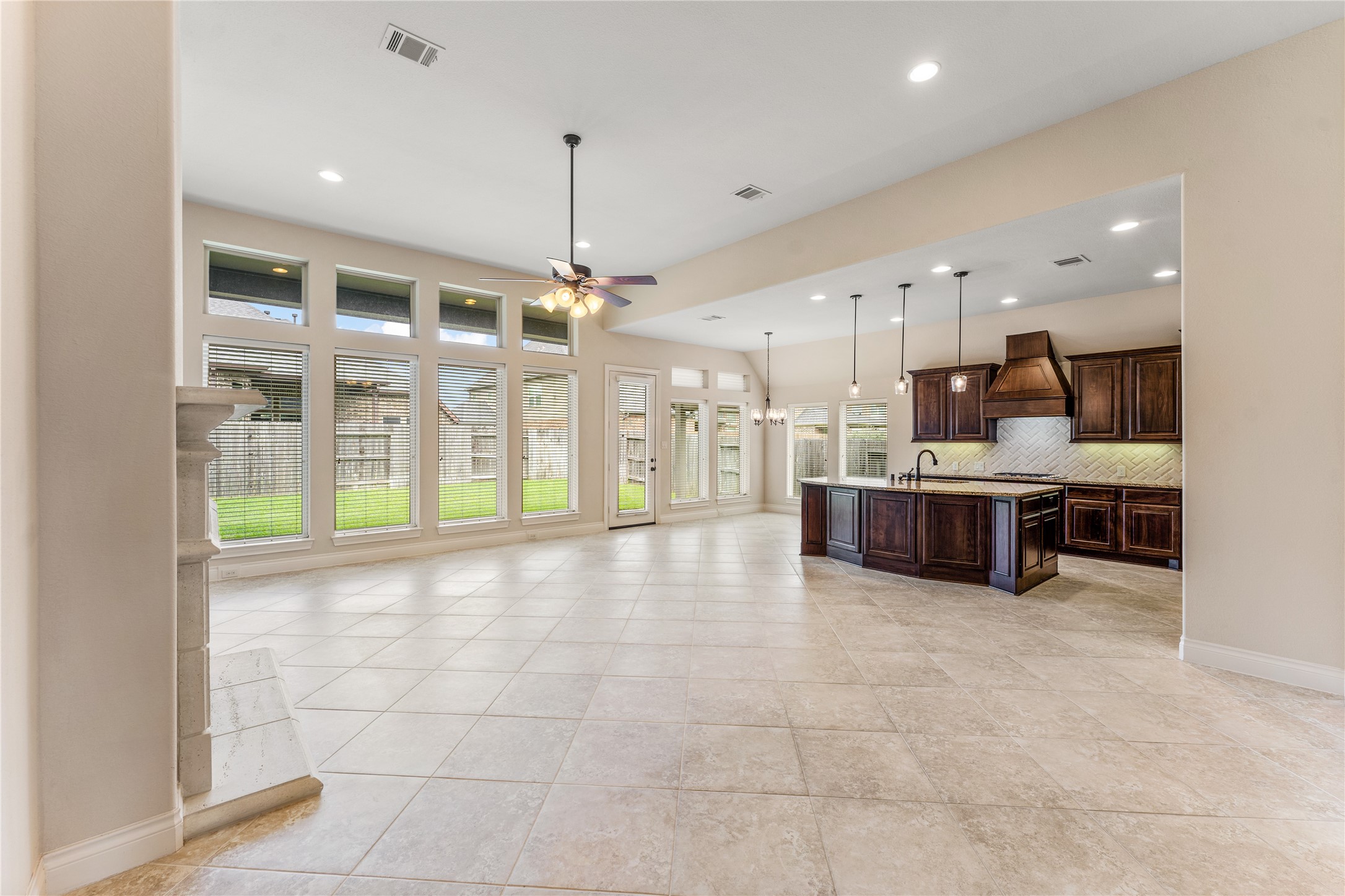 2938 Bobby Jones Road Katy, TX 77494 - Photo 28 of 28 a large kitchen with stainless steel appliances kitchen island granite countertop a large counter top and a view of living room