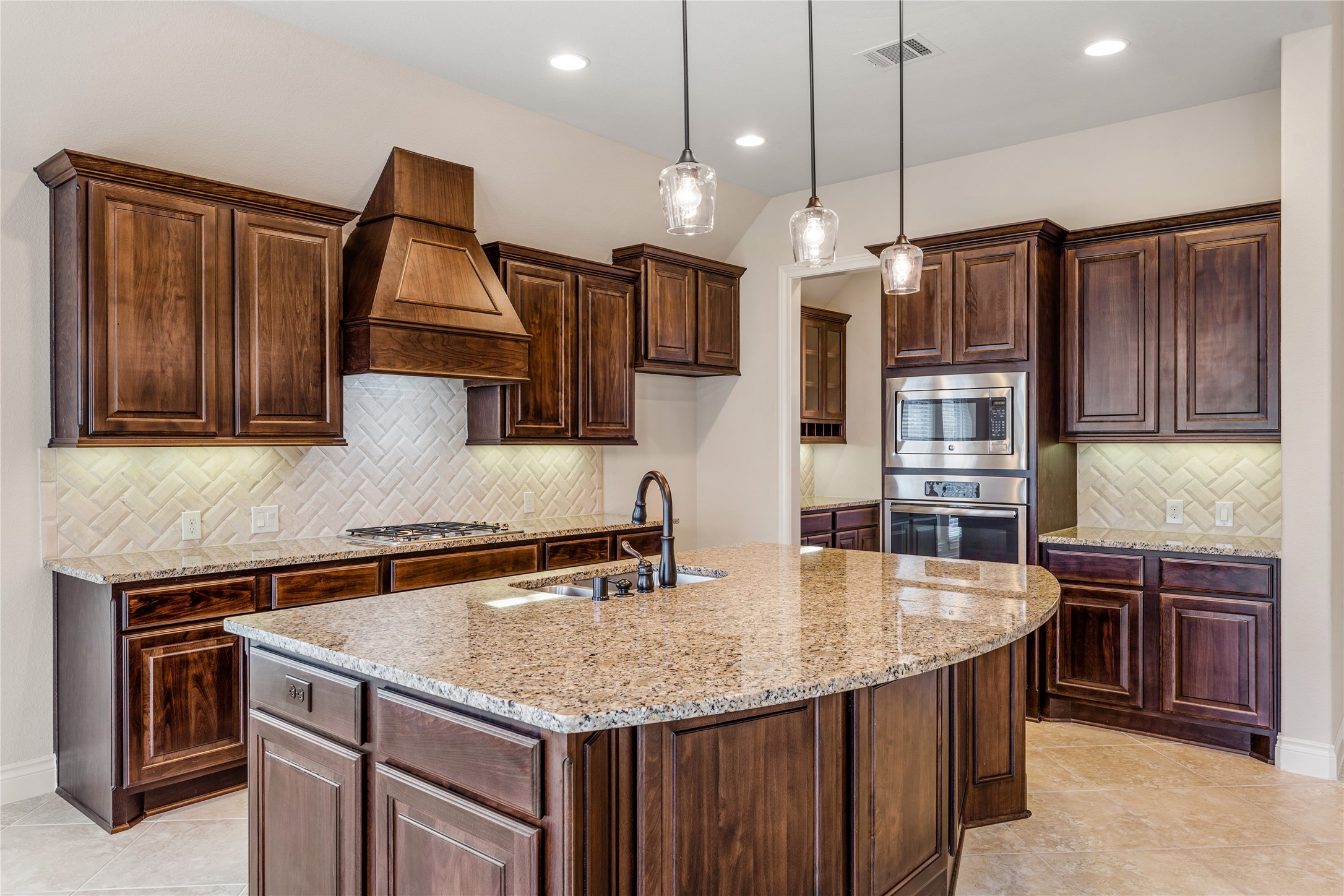 2938 Bobby Jones Road Katy, TX 77494 - Photo 8 of 28 a kitchen with stainless steel appliances granite countertop a sink a stove and a refrigerator