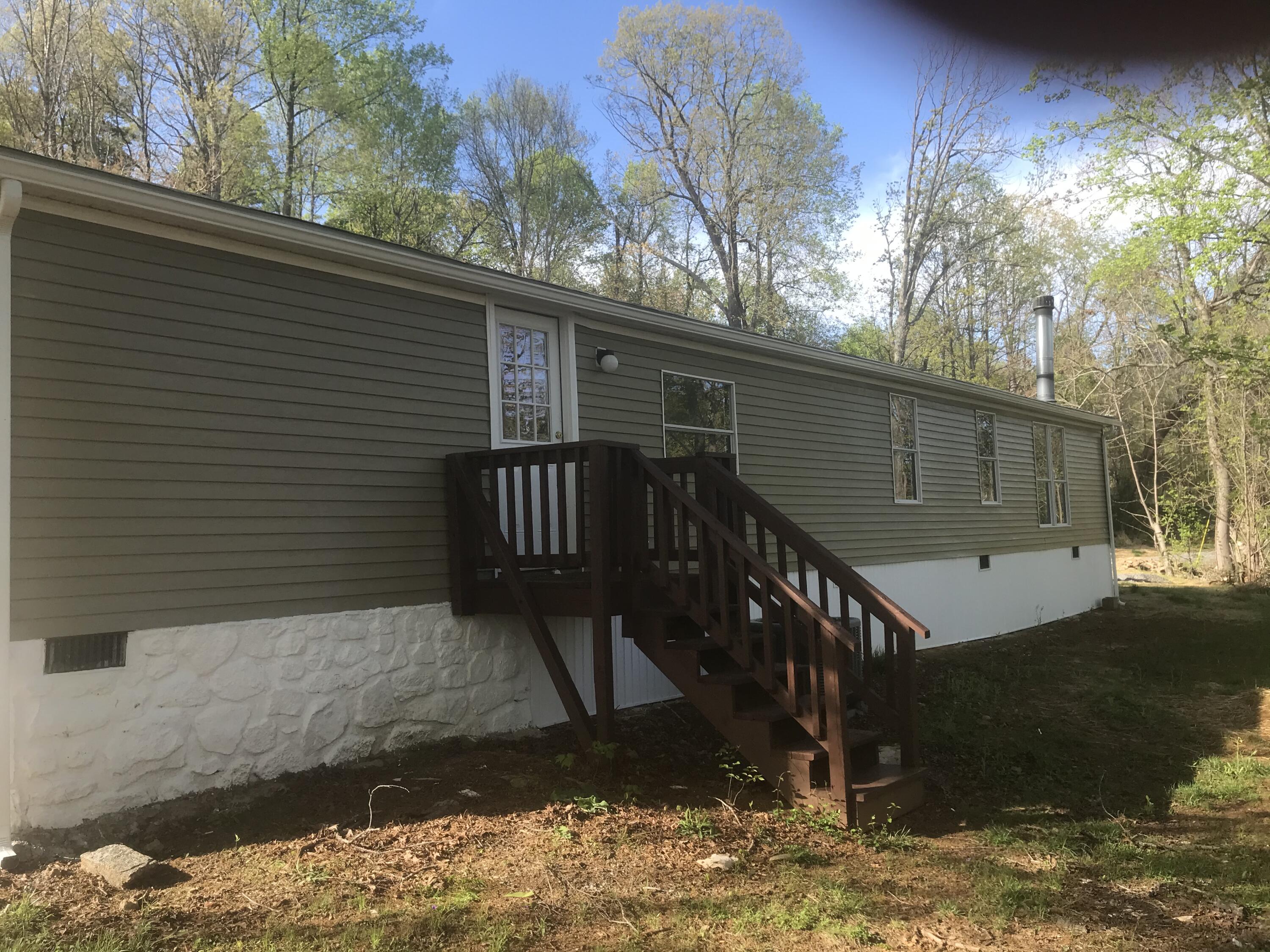 100 Lookout Ridge Road Blue Ridge, VA 24064 - Photo 2 of 11 a view of backyard with a large tree