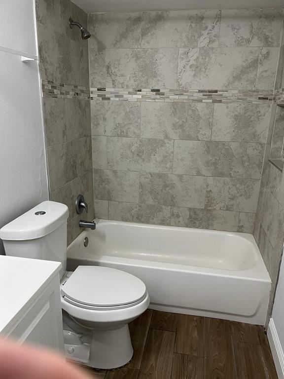 1373 Via Villanova Way Winter Springs, FL 32708 - Photo 10 of 12 a bathroom with a toilet and a bath tub