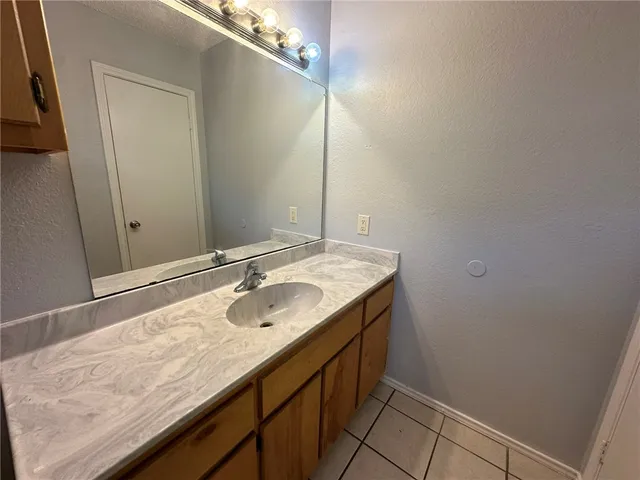 a white toilet sitting next to a bath tub