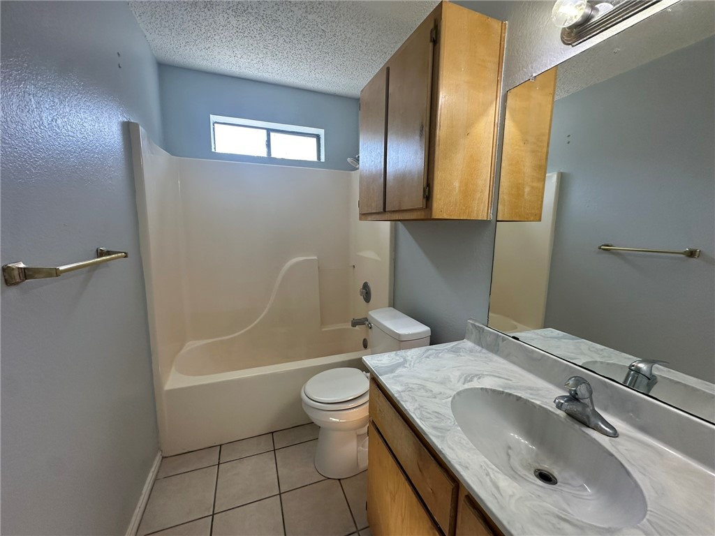 2189 Spring Park Drive Ingleside, TX 78362 - Photo 29 of 35 a bathroom with a sink toilet and shower