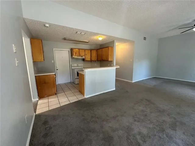 a view of kitchen and a window