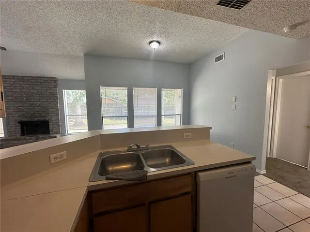 a kitchen with a sink and a window