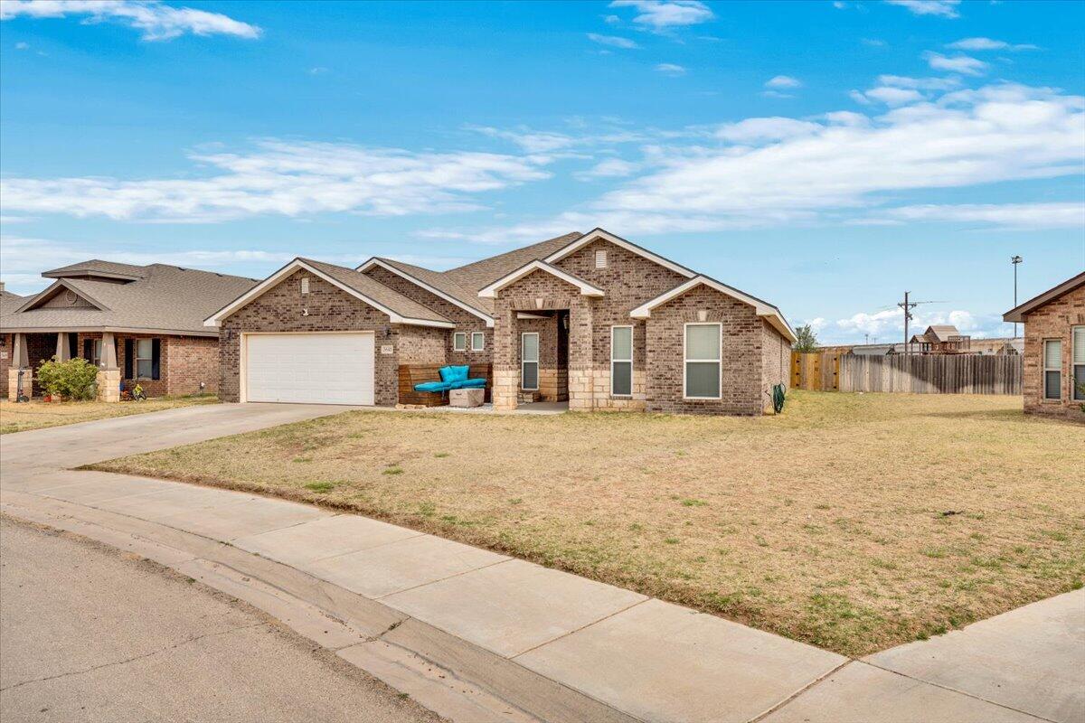 3641 Ridgely Avenue Lubbock, TX 79407 - Photo 2 of 32 a view of a house with a yard