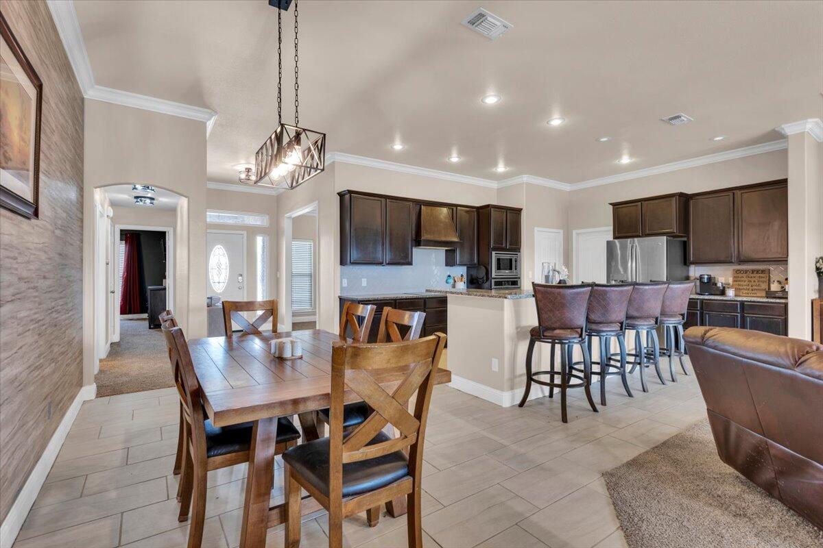 3641 Ridgely Avenue Lubbock, TX 79407 - Photo 8 of 32 a view of a dining room with furniture