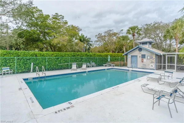 a view of a house with a yard and a patio