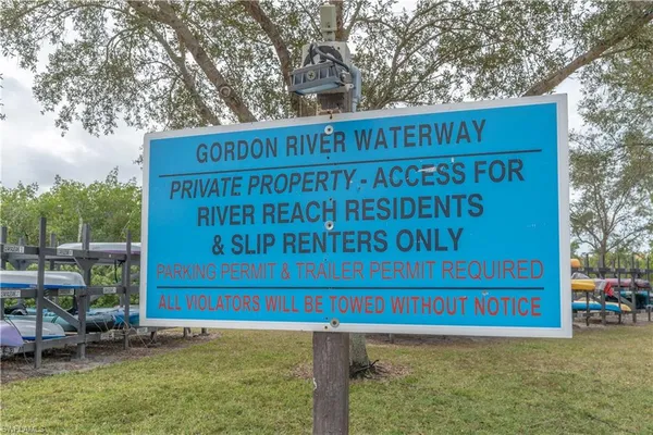 a sign on the side of the road