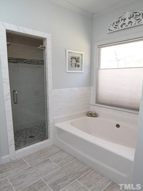 11800 Pembridge Lane Raleigh, NC 27613 - Photo 11 of 25 Remodeled shower with custom glass door, glass inlay and pebble floor.