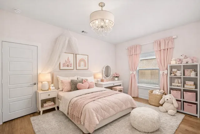 a bedroom with a large bed and a chandelier