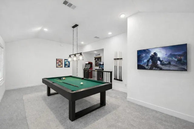 a living room with furniture and a table