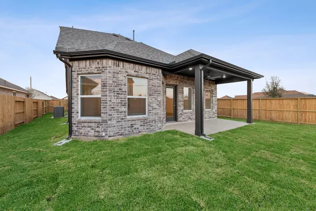 a view of a swimming pool with an outdoor seating