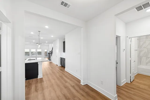 a view of a kitchen from the hallway