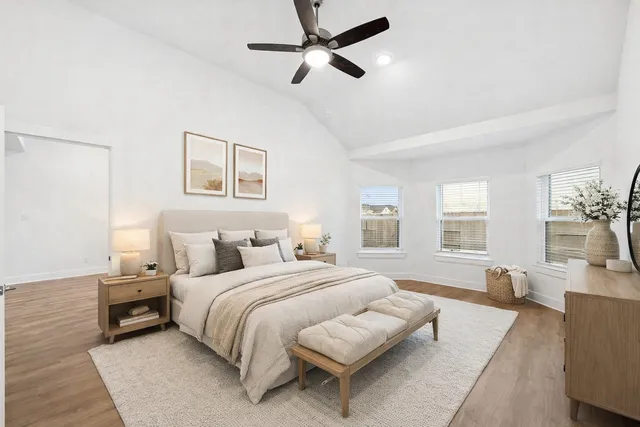 a bedroom with bed and a couch