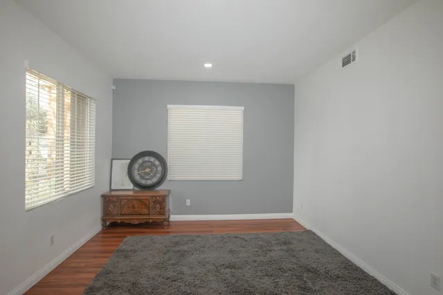 a view of room with window and hardwood floor