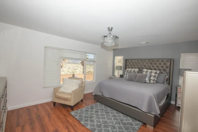 a bedroom with a bed and a couch