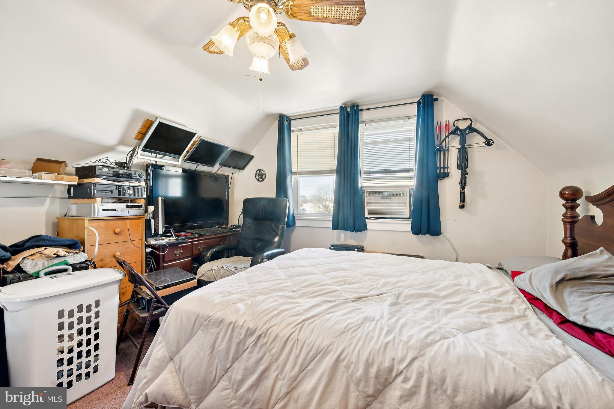 315 Rancocas Avenue Riverside, NJ 08075 - Photo 19 of 24 a bedroom with a bed and a chandelier