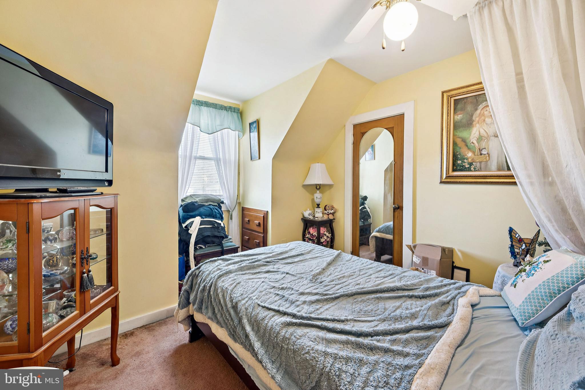 315 Rancocas Avenue Riverside, NJ 08075 - Photo 21 of 24 a bedroom with a bed and wooden floor