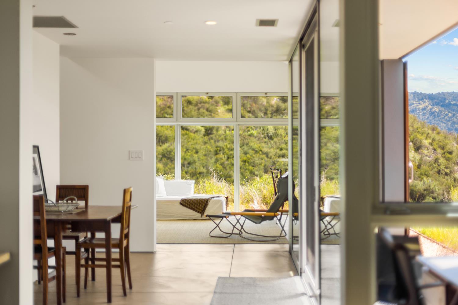 12179 Koenigstein Road Santa Paula, CA 93060 - Photo 39 of 43 a living room with furniture and a floor to ceiling window