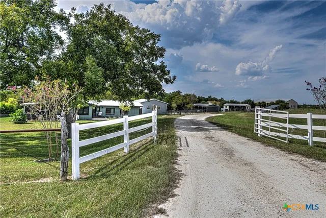a view of a house with a big yard