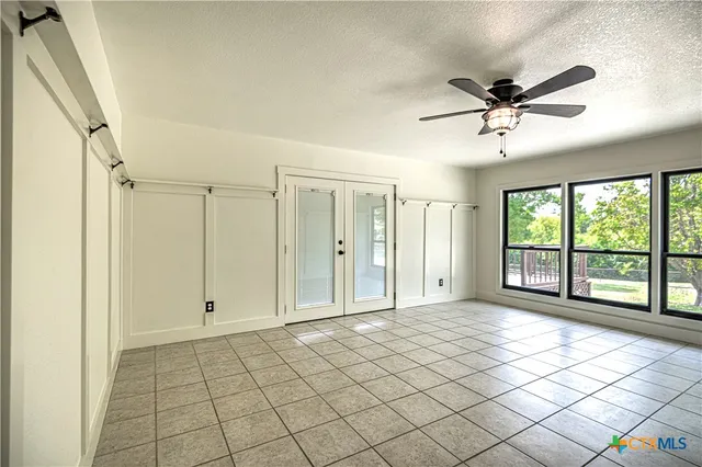 a bathroom with a sink mirror and shower