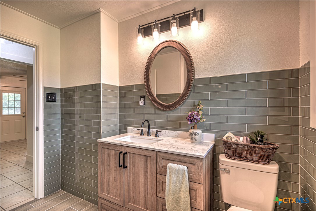 2810 FM 438 Loop Temple, TX 76501 - Photo 16 of 47 a bathroom with a sink and a mirror