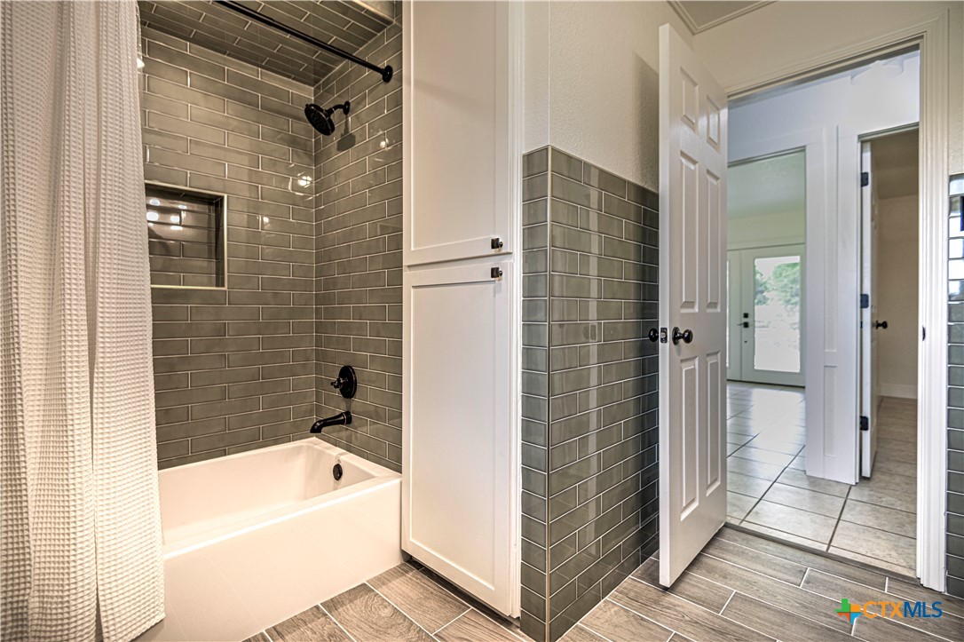 2810 FM 438 Loop Temple, TX 76501 - Photo 17 of 47 a bathroom with a bathtub and a shower