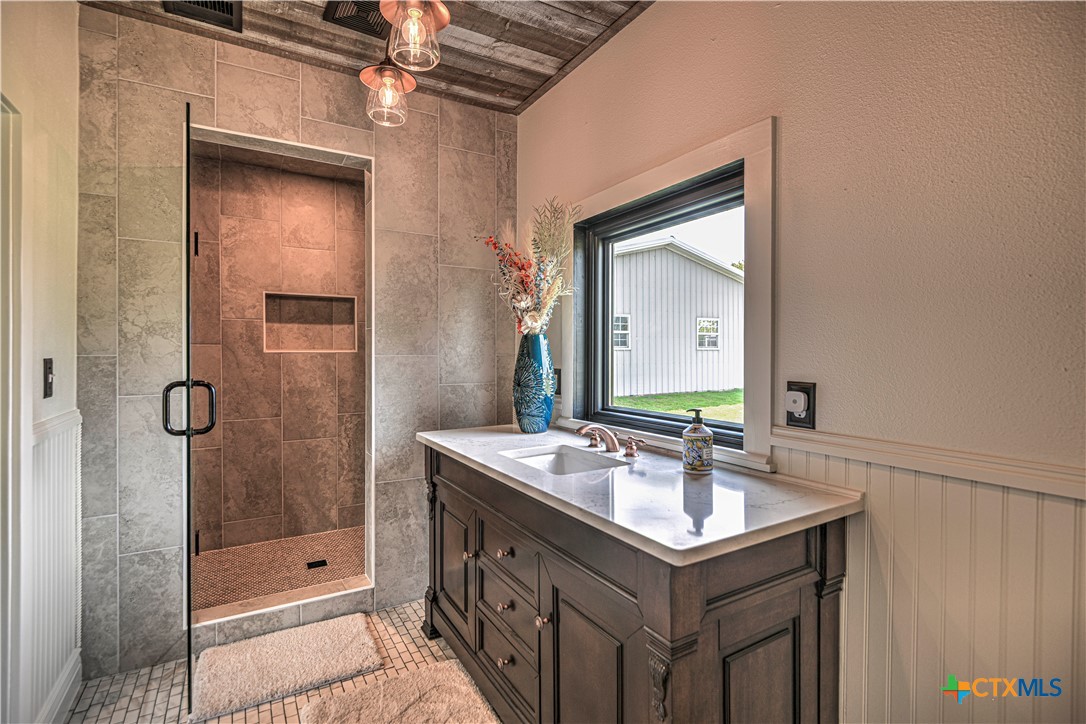 2810 FM 438 Loop Temple, TX 76501 - Photo 23 of 47 a bathroom with a sink mirror and shower